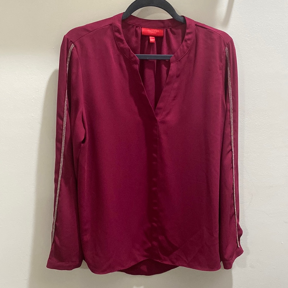Jennifer Lopez dark red blouse